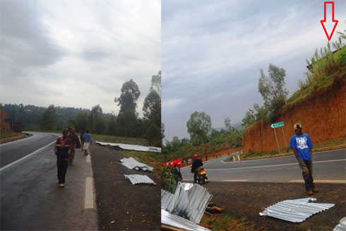 Aya mabati yaturutse ku nzu iri haruguru y'umuhanda araguruka agwa hano hepfo y'uyu muhanda wa kaburimbo.